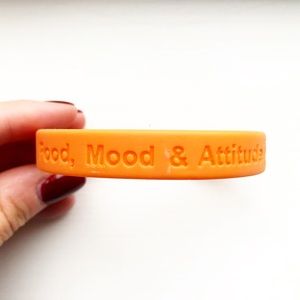 Orange rubber ‘Food, Mood & Attitude’ bracelet